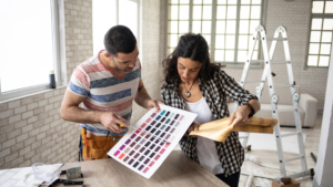 Interior designers pick color schemes on paint color sample sheet