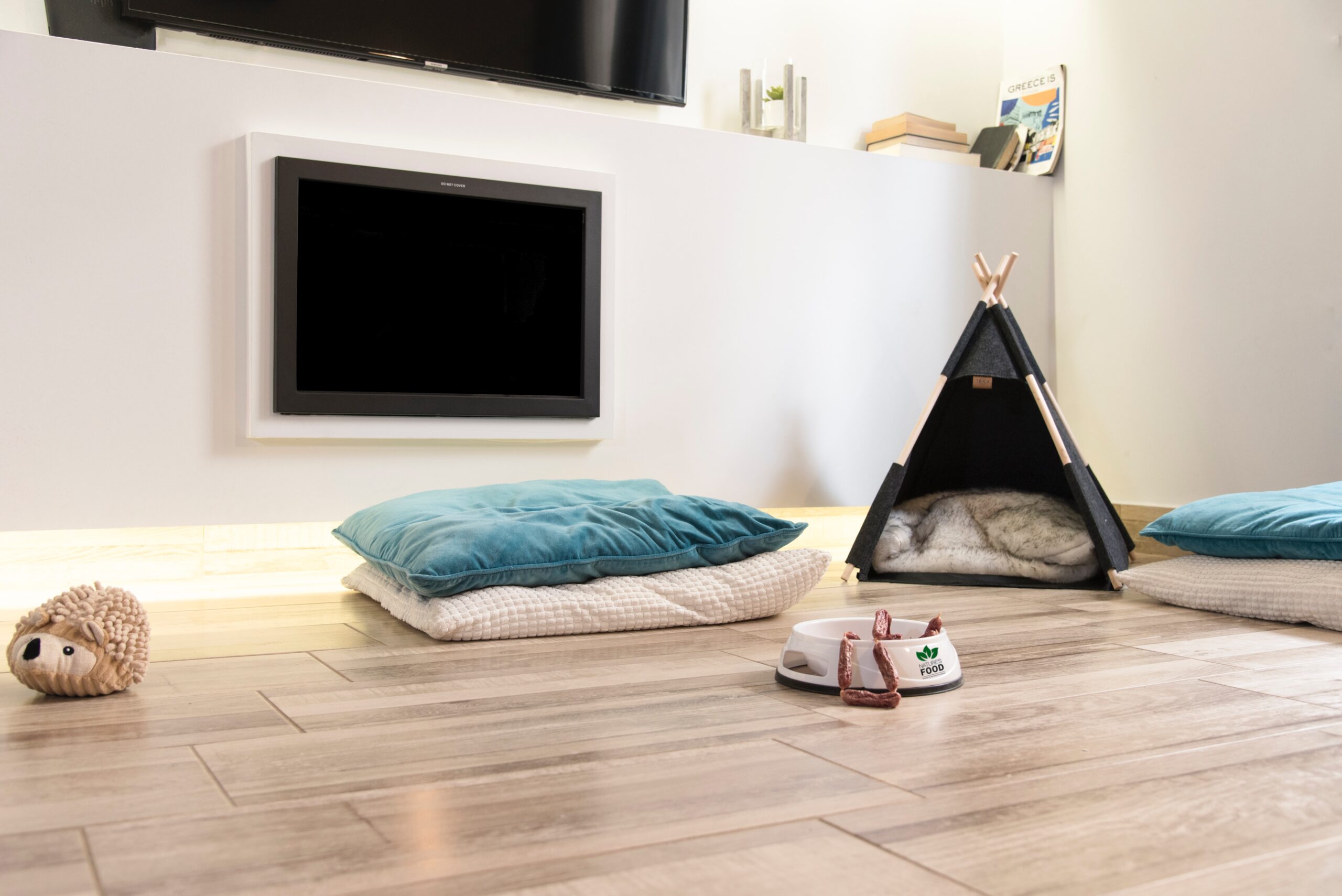Dog toys and dog beds on luxury vinyl plank pet friendly flooring