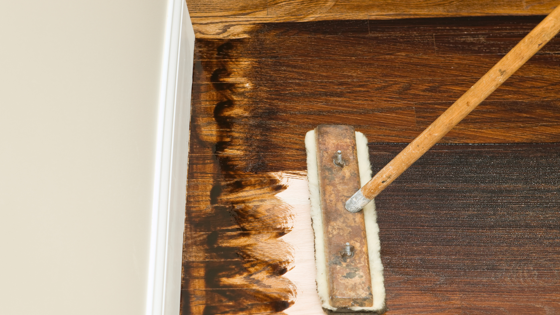 Dark stain application on natural hardwood floor
