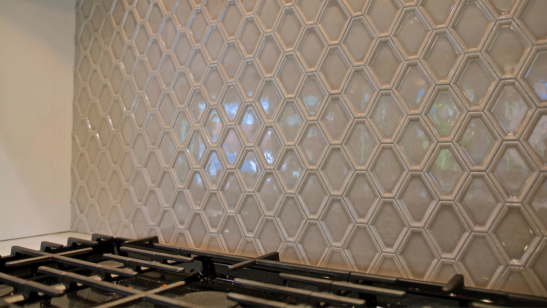 Glossy Hexagon Tile Kitchen Backsplash Above Gas Stove in Kitchen