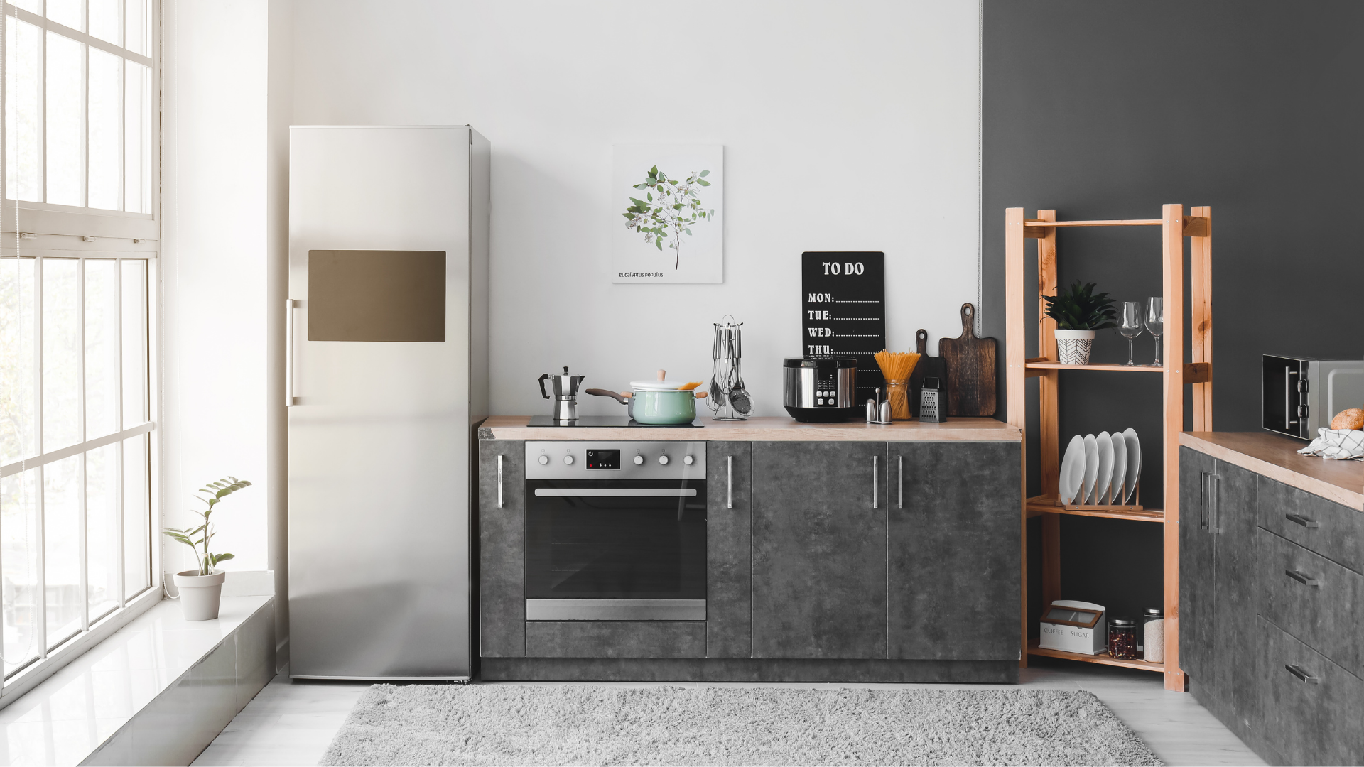 Modern grey kitchen with natural lighting