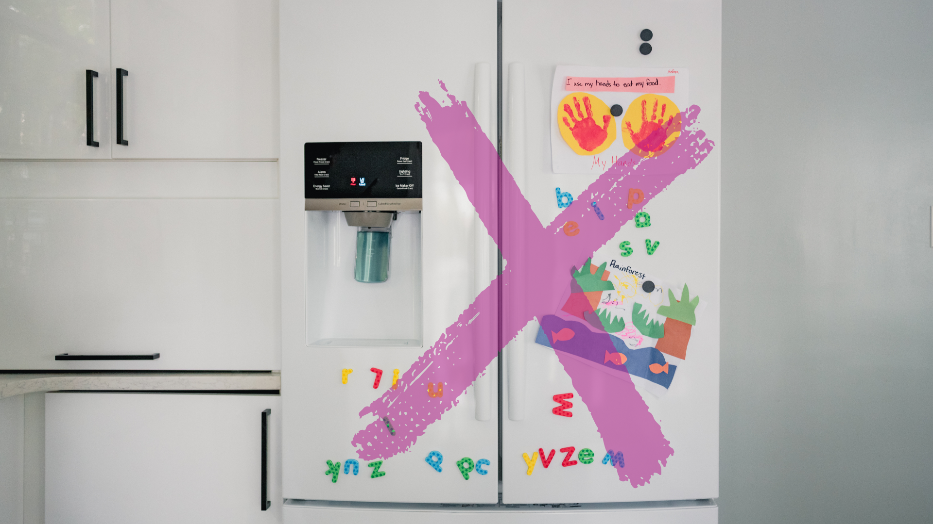 White fridge with magnets and child artwork crossed out with an X